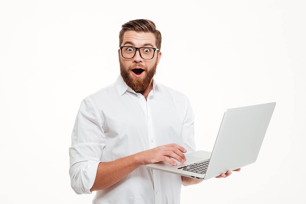 happy man on laptop